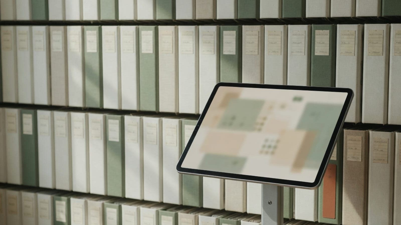 Archive of study binders beside a single research kiosk
